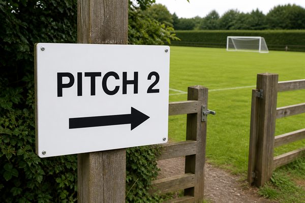 Illustrative photo of a Pitch 2 sign pointing towards the football pitch